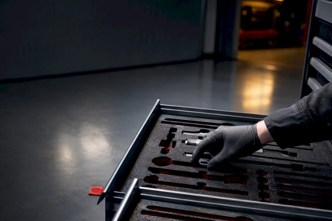 Technician checking an organized tool tray