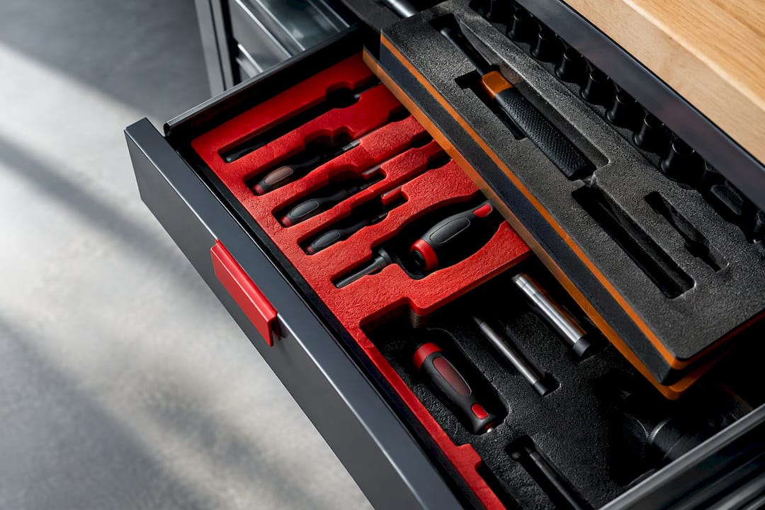 Layered foam inserts in organized tool drawer
